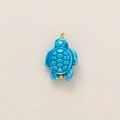 Close-up of blue sea turtle pendant with 18k gold plating and smooth ceramic texture - Blue Turtle Pendant