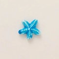 Detail of blue starfish pendant accessory with 18k gold plating and embossed dots - Blue Polka Dot Starfish Pendant