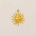 Detailed macro shot of 18k gold-plated sun pendant with artistic face and matte finish - Spiky Sun Pendant