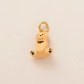 Close-up of a cute orange bear pendant with yellow bow and golden metal ring connector - Spreading Bear Charm