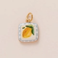 Macro shot of square enamel lemon pendant charm with blue polka dot border and gold ring - No.30 Square Lemon Style