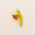 Detail of colorful flower pendant with green stem and orange petal on beige background - Daisy Flower Pendant