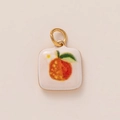 Detail view of square white enamel charm featuring hand-painted orange fruit with gold loop - No.31 Square Orange Style