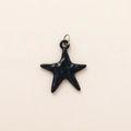 Minimalist black ceramic starfish pendant with polished glaze and silver ring detail - Black Star Pendant