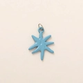 Detail of light blue enamel star pendant with polished finish and silver metal ring - Blue Star Pendant