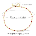 Macro shot of red faceted crystal beads with golden metal spacers and lobster clasp - 18K Gold / Red Rhombus Beads Style (KN0041)
