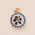 Detail of round gold pendant with red berry print and blue polka dot border - Round Cherry Pendant