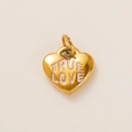 Macro detail of heart charm with TRUE LOVE engraving and gold plated stainless steel finish - Engraved Love Heart Pendant No. 6