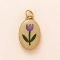 Detail of oval pendant featuring purple tulip enamel design and gold-plated edges - Yellow with Pink Flower Pendant