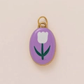 Macro detail of oval pendant featuring purple enamel with white tulip floral pattern - Purple Small White Flower Pendant