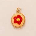 Detail of round gold-plated pendant with red and yellow enamel flower pattern - Red Flower Pendant