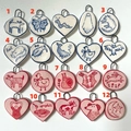 Handmade ceramic pendants in various animal shapes with blue and red 18K gold accents - Abstract Dog Pendant