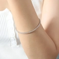 Versilberte Tennisarmband mit runden Zirkoniasteinen und dehnbarem Design - Champagner Zirkonia Stahlfarbe