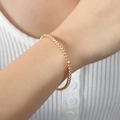 Elegantes vergoldetes Tennisarmband mit funkelnden weißen runden Zirkonia-Steinen - Champagner Zirkonia Goldfarbe
