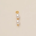 Detailed view of dual white oval pearls with gold beads and a top connection ring - Double Pearl Linear Style (3)