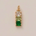 Close-up of 14k gold-plated flower pendant with vertical triple gemstone setting in detail - Green Zircon Pendant
