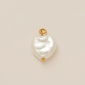 Macro shot of heart-shaped baroque pearl pendant with 18k gold plated bail and texture - Heart Pearl Drop