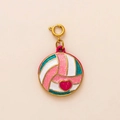 Detailed macro shot of a colorful volleyball pendant with a pink heart and gold ring - Volleyball