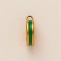 Macro detail of 18K gold-plated pendant with green enamel inlay for DIY jewelry - Green Enamel Jewelry Buckle