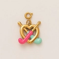 Detail of 18K gold-plated heart and hockey stick charm with pink enamel accents - Racket Heart Charm