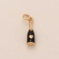 Detail of a gold champagne bottle pendant with black enamel finish and a heart accent - Champagne Bottle Pendant
