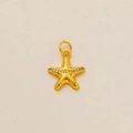 Detailed close-up of a 18K gold-plated starfish pendant with sparkling white zircons - Golden Starfish