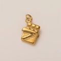 Macro shot of 18K gold plated chocolate bar pendant with realistic wrapper texture detail - Chocolate Pendant
