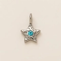 Detail of star-shaped stainless steel pendant with hammered texture and blue center stone - No.14 Blue Zircon Star