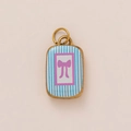 Macro detail of rectangle gold plated pendant with blue stripes and pink bow design - No.5 Bowknot Square Tag