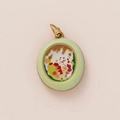 Detailed macro view of an oval vintage art pendant with light green matte frame and golden ring - Green Edge Flower in Grass Pendant 11
