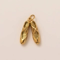 Detailed close-up of golden ballet shoe pendants with fine polished 18K gold finish - Double Ballet Shoes Style