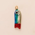 Detailed macro view of a colorful fish charm with gold ring for DIY keychain and bag styling - Fish Pendant Style 1