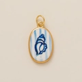 Macro view of oval gold pendant featuring a blue conch shell over striped background - Blue Conch Pendant Only (Without Chain)