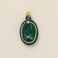 Macro view showing a dark green oval pendant with star-patterned glitter and a gold metal ring - Green Dance Shoes