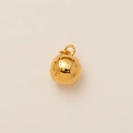 Detail of a 18K gold-plated baseball pendant with fine texture and metal loop - Realistic Baseball Style