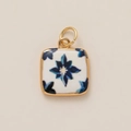 Detail of square ceramic pendant with blue floral pattern and gold metal frame - Blue Flower Pendant