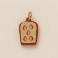Macro detail of toast-shaped pendant with strawberry print and gold vacuum plating - Peach Pendant