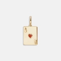 Macro shot of gold-plated Ace of Hearts poker pendant with a sparkling red heart zircon - Ace of Hearts Playing Card Pendant