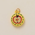Close-up of a yellow round apple pendant charm with a gold-colored metal hanging ring - Large Apple