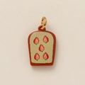 Macro shot of strawberry toast enamel pendant featuring golden metal alloy and glitter - Strawberry Bread