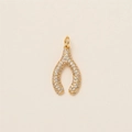 Macro detail of a gold wishbone pendant featuring micro-pave white zircon stones - Horseshoe Style A