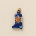 Detailed view of dark blue cowboy boot pendant with colorful floral patterns and gold ring - Blue Snow Boots