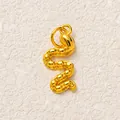 Detailed view of the gold snake pendant showing textured S-shaped scale patterns - Gold Sea Snake