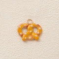 Realistic pretzel food charm in yellow with white salt specks and golden metal ring - Pretzel Pendant