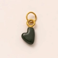 Detailed view of a dark green heart-shaped gemstone pendant with golden metal rings - May Heart Pendant