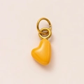 Minimalist heart charm with bright yellow enamel finish and golden rings on pink background - November Heart Pendant
