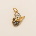 Macro detail of a gold cowboy hat pendant with sparkling rhinestones and a star charm - Black Rhinestone Cowboy Hat Style