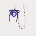 Dettaglio del ciondolo Occhio del male placcato oro 18K con fiocco e cinturino di perle - Stile Malocchio Blu Scuro