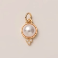 Detail showing high-polish 14K gold pendant with a large pearl and three zircon accents - White Artificial Pearl and Zirconia Pendant
