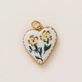 Detailed macro view of heart pendant with 18K gold plating and yellow flowers - Yellow Floral Heart Style